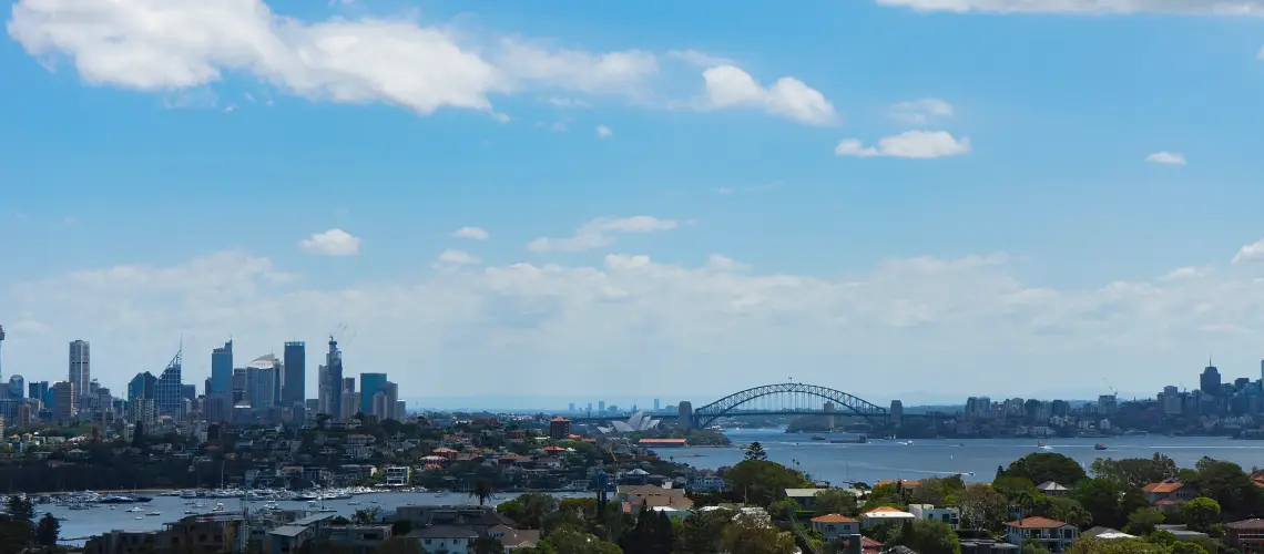 Sydney skyline with residential homes, representing property valuation trends in the city