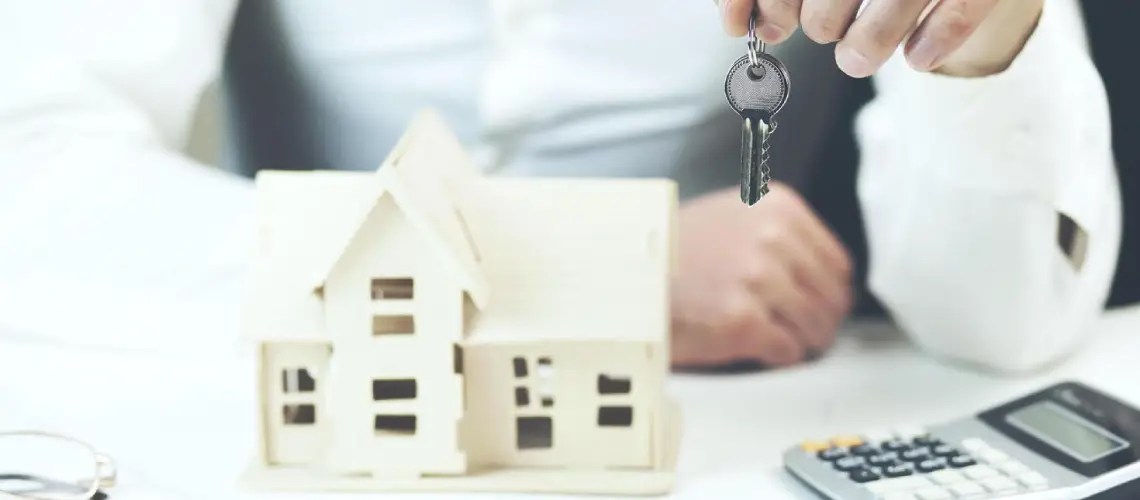 Australian tax forms and house keys representing property valuation for tax obligations