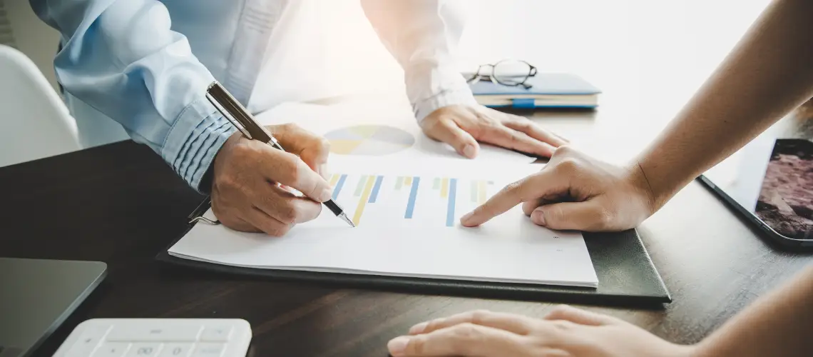Independent business valuer reviewing financial documents